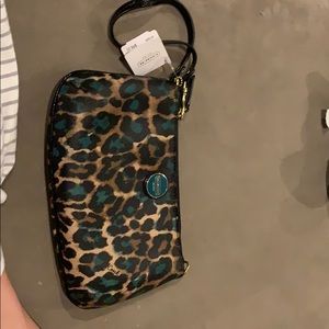 Coach clutch with tags